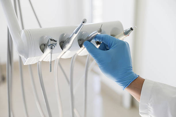 Professional Tooth Extraction technician working in St. Charles, IL
